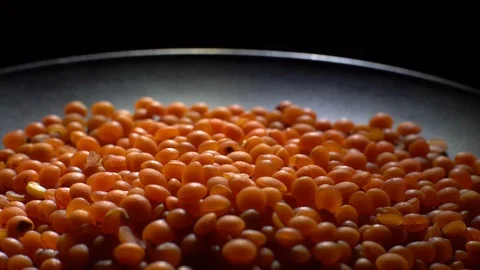 Lentils. Heap of raw uncooked red lentils in bowl in rotation. Stock Footage 102479065