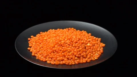 Lentils. Heap of raw uncooked red lentils in bowl in rotation. Stock Footage 102479205