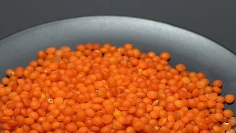 Lentils. Heap of raw uncooked red lentils in bowl. Stock Footage 102479292