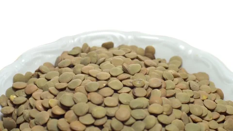 Lentils. Rotation. Close up. Heap of raw uncooked brown lentils. Stock Footage 102411093