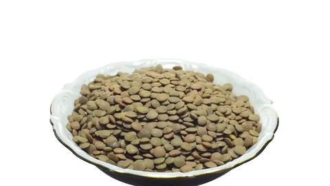Lentils. Rotation. Close up. Heap of raw uncooked brown lentils. Stock Footage 102411204