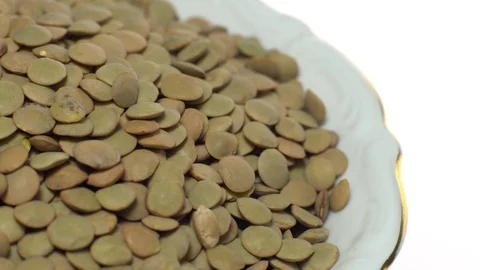 Lentils. Rotation. Close up. Heap of raw uncooked brown lentils. Stock Footage 102411377