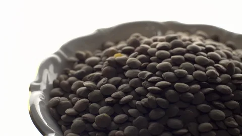 Lentils. Rotation. Close up. Heap of raw uncooked brown lentils. Stock Footage 102411388