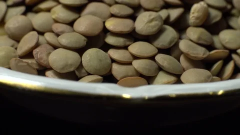 Lentils. Rotation. Close up. Heap of raw uncooked brown lentils. Stock Footage 102411529