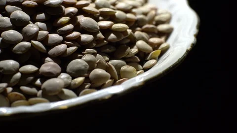 Lentils. Rotation. Close up. Heap of raw uncooked brown lentils. Stock Footage 102411602