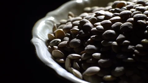 Lentils. Rotation. Close up. Heap of raw uncooked brown lentils. Stock Footage 102411700