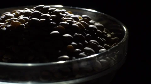 Lentils. Rotation. Close up. Heap of raw uncooked brown lentils. Video stock 102411763