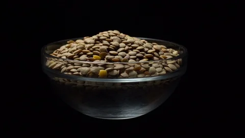 Lentils. Rotation. Close up. Heap of raw uncooked brown lentils. Video stock 102411890