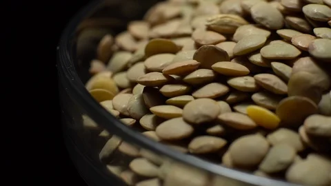 Lentils. Rotation. Close up. Heap of raw uncooked brown lentils. Stock Footage 102411896