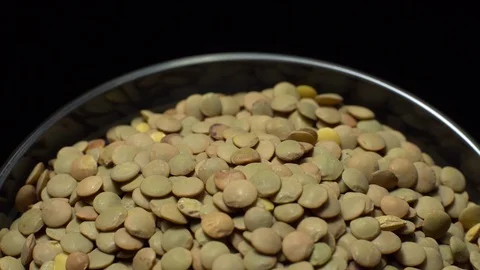 Lentils. Rotation. Close up. Heap of raw uncooked brown lentils. Video stock 102412008