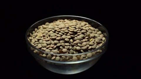 Lentils. Rotation. Close up. Heap of raw uncooked brown lentils. Stock Footage 102412217