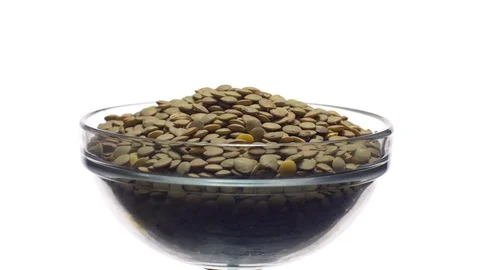Lentils. Rotation. Close up. Heap of raw uncooked brown lentils. Stock Footage 102412338