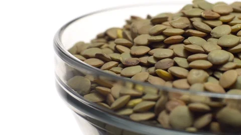 Lentils. Rotation. Close up. Heap of raw uncooked brown lentils. Video stock 102412344
