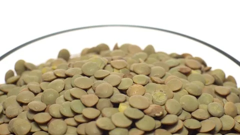 Lentils. Rotation. Close up. Heap of raw uncooked brown lentils. Stock Footage 102412598