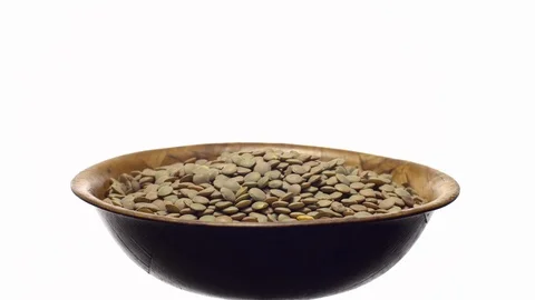Lentils. Rotation. Close up. Heap of raw uncooked brown lentils. Video stock 102412771