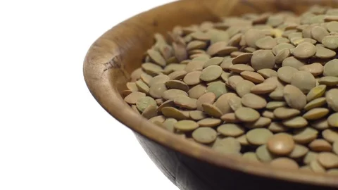 Lentils. Rotation. Close up. Heap of raw uncooked brown lentils. Video stock 102412837