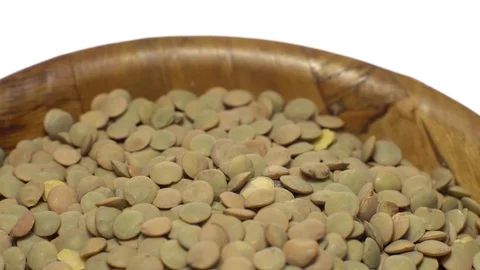 Lentils. Rotation. Close up. Heap of raw uncooked brown lentils. Video stock 102412953