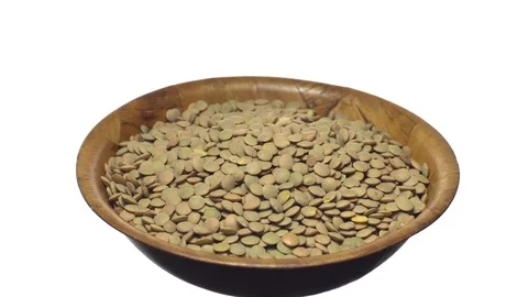 Lentils. Rotation. Close up. Heap of raw uncooked brown lentils. Video stock 102413167