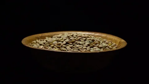 Lentils. Rotation. Close up. Heap of raw uncooked brown lentils. Video stock 102413367