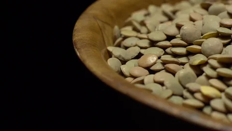 Lentils. Rotation. Close up. Heap of raw uncooked brown lentils. Video stock 102413419