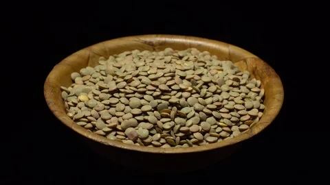 Lentils. Rotation. Close up. Heap of raw uncooked brown lentils. Video stock 102413508