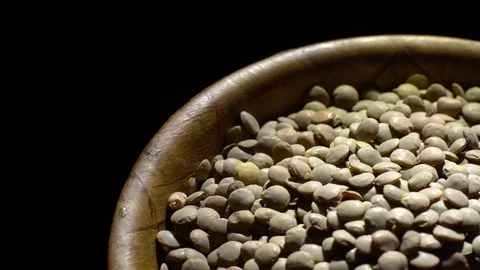 Lentils. Rotation. Close up. Heap of raw uncooked brown lentils. Video stock 102413633