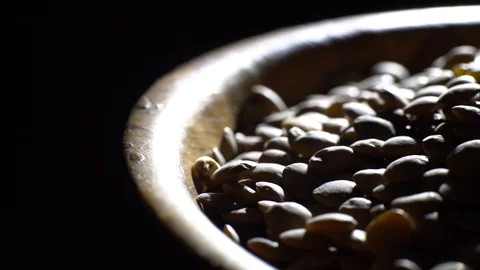 Lentils. Rotation. Close up. Heap of raw uncooked brown lentils. Video stock 102413699