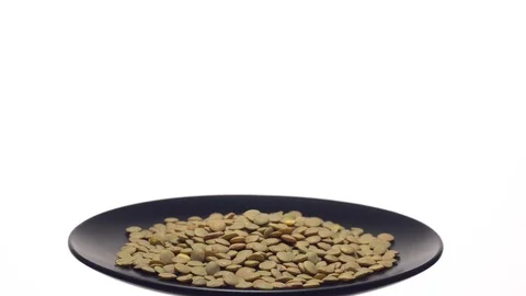 Lentils. Rotation. Close up. Heap of raw uncooked brown lentils. Stock Footage 102458737