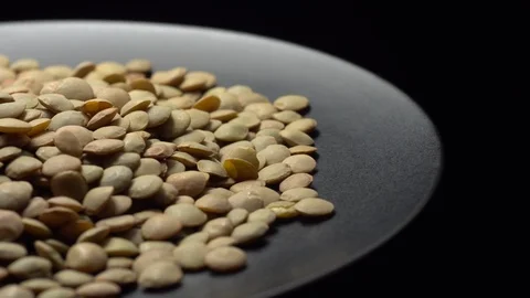 Lentils. Rotation. Close up. Heap of raw uncooked brown lentils. Stock Footage 102458949