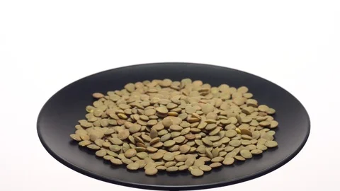 Lentils. Rotation. Close up. Heap of raw uncooked brown lentils. Stock Footage 102459325