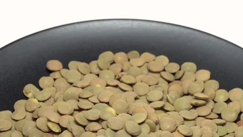 Lentils. Rotation. Close up. Heap of raw uncooked brown lentils. Stock Footage 102459458