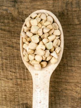 Lentils in spoon Stock Photos