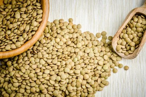 Lentils, on table cloth, background, close up Stock Photos