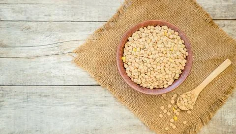 Lentils in teralke on the table. Selective focus. Stock Photos