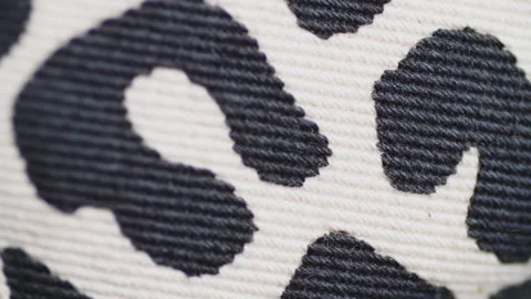 Leopard animal print close-up, spotted fabric texture Stock Footage 243565460