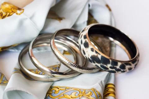 Leopard bracelet on silk scarf; fashion accessories Stock Photos