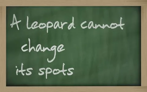 " a leopard cannot change its spots " written on a blackboard Stock Photos