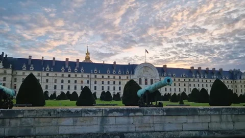 Les Invalides in Paris at sunset, featuring the Army Museum behind historic cann Stock Footage 325081129