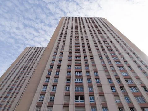Les Olympiades building complex reaching up into cloudy sky Stock Photos