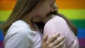 Lesbian couple embracing tenderly, publicly expressing feelings, same-sex love 4k or 4k+ Resolution