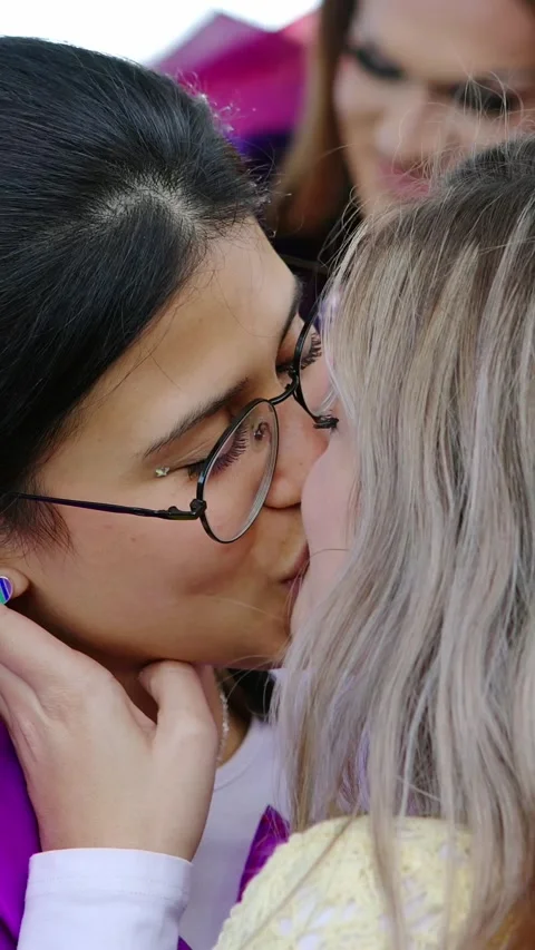 Lesbian couple embracing taking a selfie inside a taxi Видео Stock | Adobe Stock