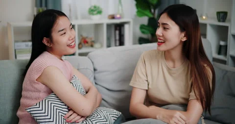 Lesbian couple talking and sharing moments of love and happiness together Stockbeeldmateriaal 293538019
