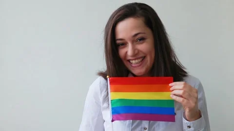 Lesbian girl with LGBT rainbow flag isol... | Stock Video | Pond5