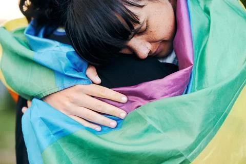 Lesbian, hug and flag with women for love, lgbtq and romance, connection and Stock Photos