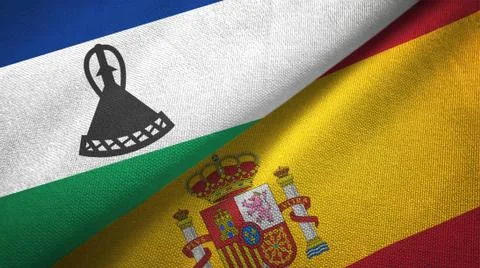 Lesotho and Spain two flags textile cloth, fabric texture Stock Illustration