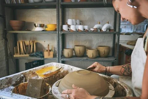 The less bumpy the better the finish. a young woman working with clay in a Stock Photos