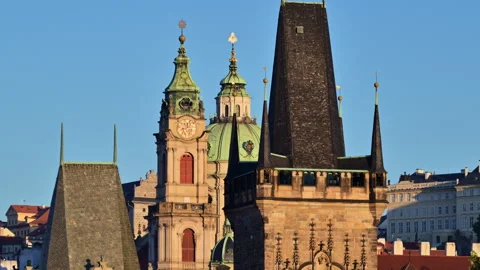 The Lesser Town Bridge Tower and the clock tower and dome of St. Nicholas Church 動画素材 342326834