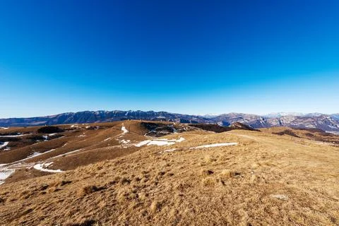 Lessinia Plateau with the Mountain Range of Monte Baldo and Adamello Brenta Stock Photos