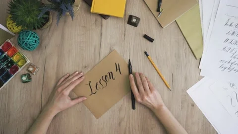 Lesson 4 Hand is Writing with Brush Pen in Calligraphy Way Stock Footage 148694926
