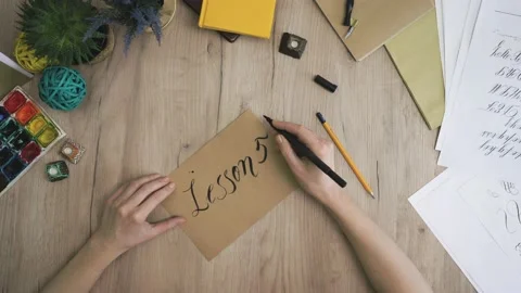 Lesson 5 Hand is Writing with Brush Pen in Calligraphy Way Stock Footage 148695126